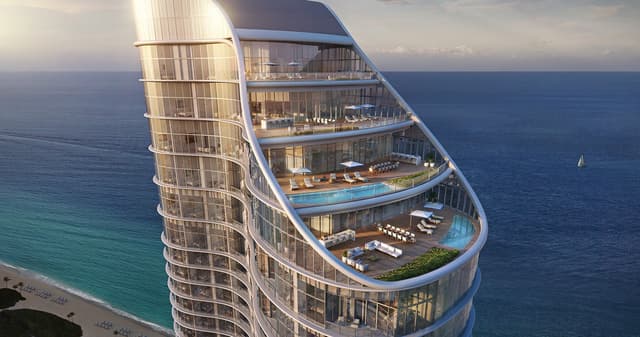 Holidaze featured Home: Luxury Oceanfront Living at Ritz-Carlton Residences - Experience the pinnacle of luxury living at the Ritz-Carlton Residences in Sunny Isles Beach. Nestled on 250 feet of pristine oceanfront, this architectural marvel by Arquitectonica boasts a stunning curvilinear design completed in 2020. This 52-story tower offers exclusive 2-to-5-bedroom residences, ranging from 1,605 to 7,688 square feet, each featuring expansive floor-to-ceiling windows that frame breathtaking views of the ocean, bay, and city.

Indulge in kitchens equipped with European appliances, imported Italian furnitures, and exquisite stone countertops. Step out onto spacious terraces to soak in the coastal breeze and panoramic vistas. Located close to the beach, serene parks, fine dining, and world-class shopping at Aventura Mall and Bal Harbour Shops, the Ritz-Carlton Residences combines luxury and convenience.

Discover unparalleled elegance and resort-style living in the heart of Sunny Isles Beach—your dream home awaits!